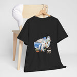 Santorini-inspired graphic tee on a chair, perfect for beach vacations and travel gifts. Custom t-shirt, My Name Is POD.