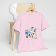 Santorini-inspired pink graphic tee on a chair, perfect for summer beach outings. Custom t-shirt from My Name Is POD.